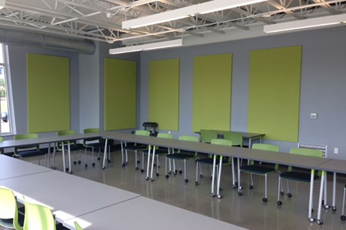 MBI Products Colorsonix acoustic wall panels installed in a classroom to control noise and make an environment better suited to learning